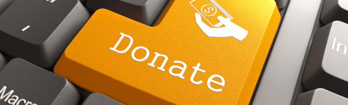 Orange Donate Button on Computer Keyboard