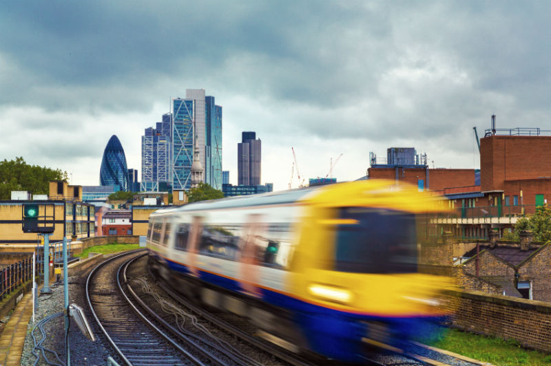 London Overground with skyscrapers.