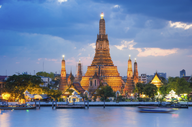 View of Wat Arun Temple from the Chao Phraya river in Bangkok