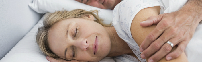 Woman asleep in bed