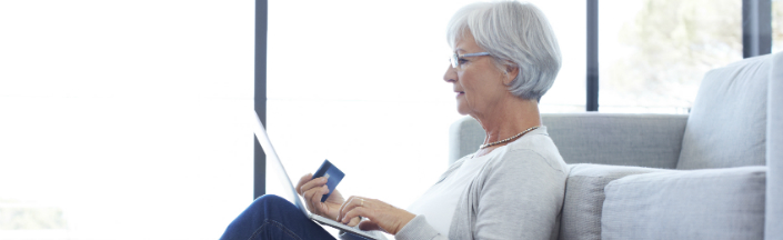 Mature woman using a laptop at home