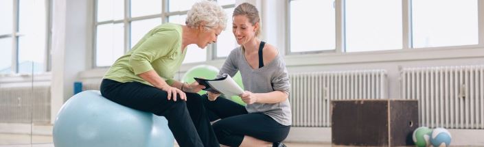 Woman exercising with trainer