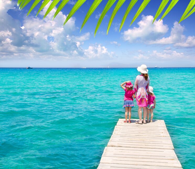 Mother and daughter on a jetty in Ibiza