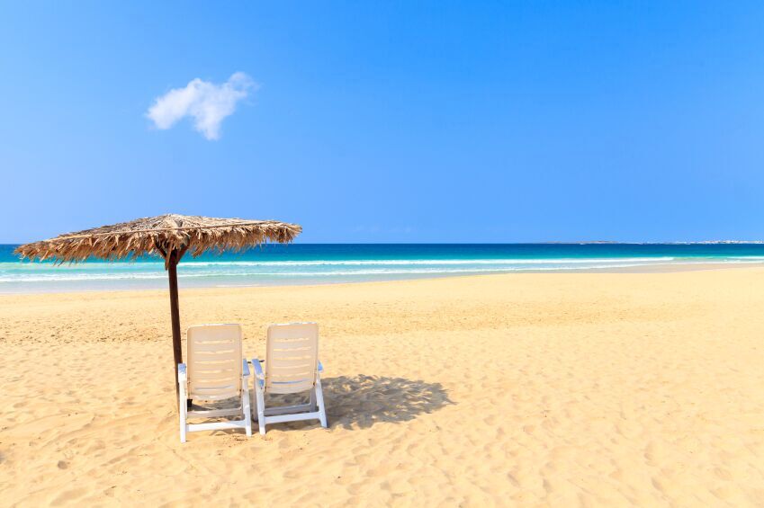 Parasol and Chair on a beach in Boavista, Cape Verde