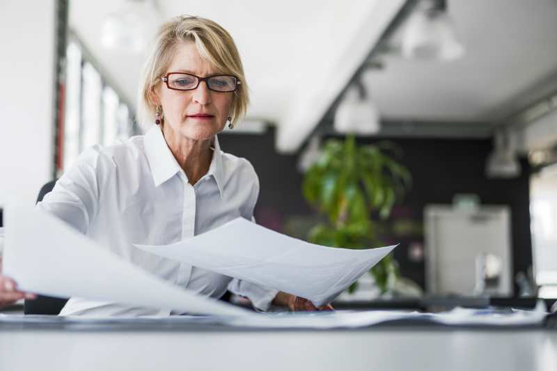 Businesswoman looking at investment portfolio