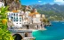 Picturesque image of the amazing Amalfi coast, with a bright and lively shore and a close up of a beautiful lemon grove.
