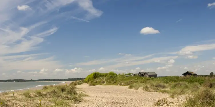 an image of a house behind a dune in Walberswick, Suffolk