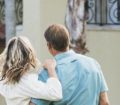 Couple looking at buying a holiday home