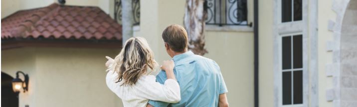 Couple looking at buying a holiday home