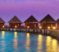 Luxury huts perched on stilts above the Indian Ocean in the Maldives.