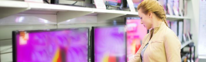 Lady looking at tv prices