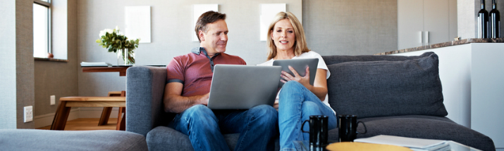Mature couple comparing insurance