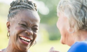 Mature friends laughing together