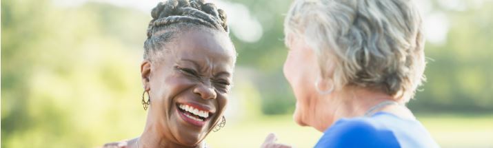 Mature friends laughing together