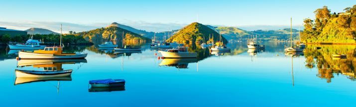 The beautiful glass-like waters of Port Chalmers Dunedin New Zealand