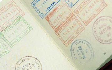 Passport with lots of stamps in