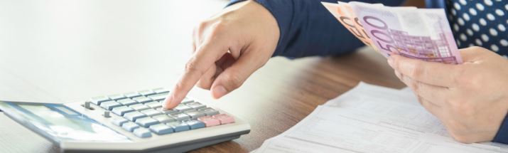 Man using a calculator
