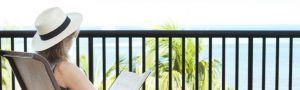 Woman reading on balcony