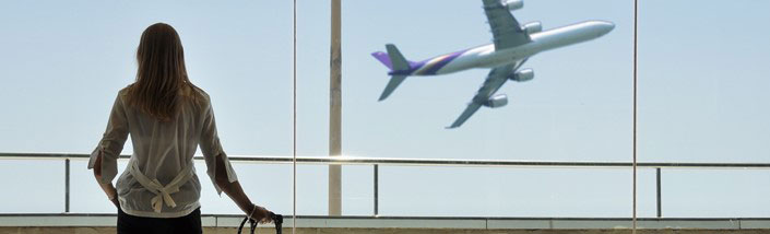 Woman watching Aeroplane take off