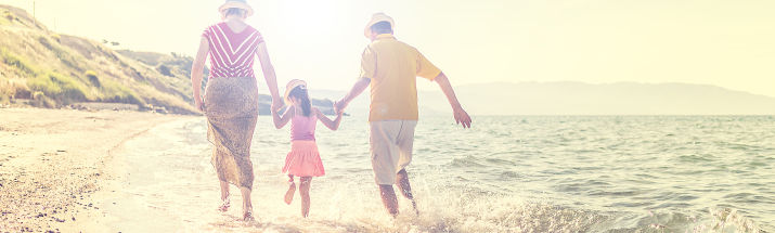 Couple and child on beach