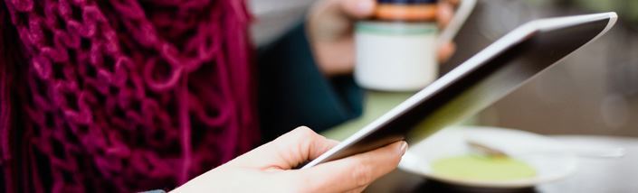 Woman reading on an iPad
