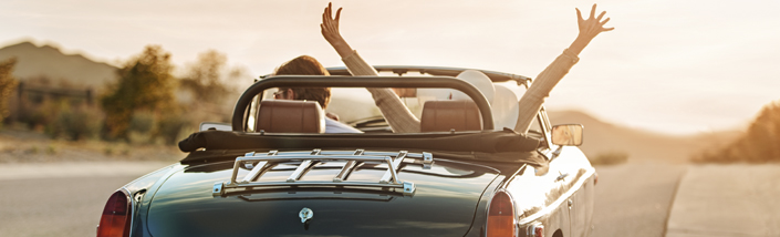 A couple driving into the sunset