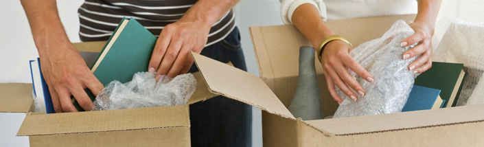 A couple packing away clutter