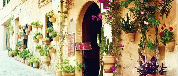 Traditional spanish street decorated by flowerpots