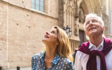 senior couple exploring european old town