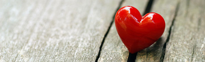 Small heart on wooden planks