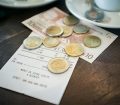 A bill in europe with euros left as tip