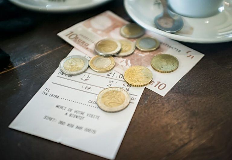 A bill in europe with euros left as tip