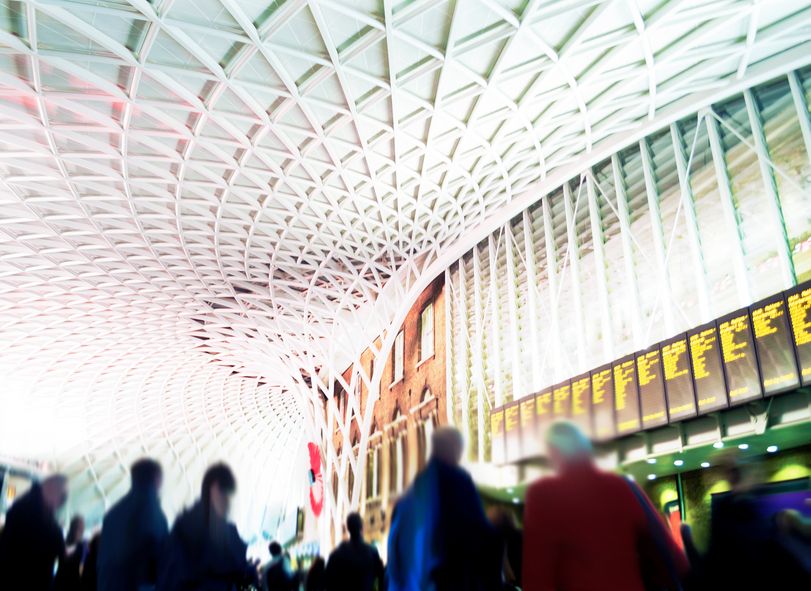 King's Cross Railway Station London - Commuters Looking At Timetables