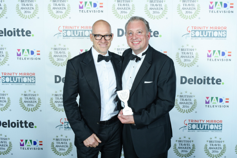 Ryan Howsam (Chairman) and Chris Rolland (CEO) collect Staysure's Best Travel Insurance Provider award