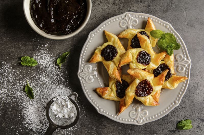 Homemade Danish pastry with vanilla pudding and plum jam