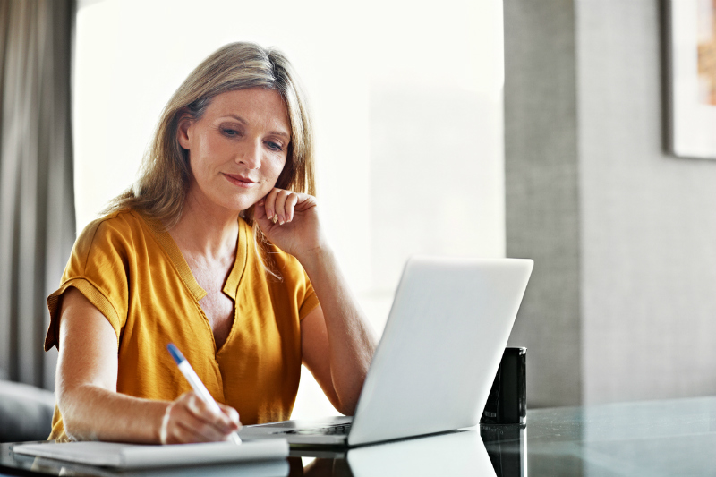 Mature woman writing