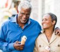 senior couple walking with ice cream
