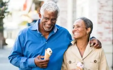 senior couple walking with ice cream
