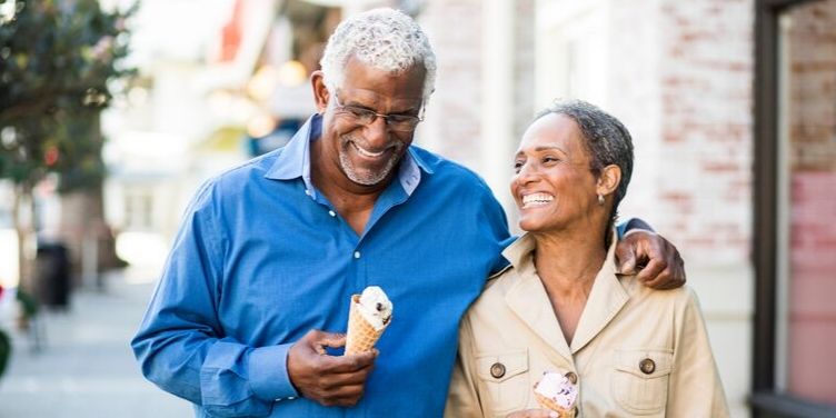 senior couple walking with ice cream