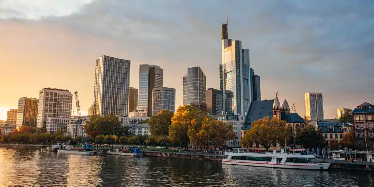 A view across Frankfurt’s financial district showing skyscrapers over the river.