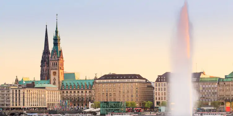 A view of Hamburg’s town hall across the lake Binnenalster