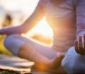 woman meditating outdoors
