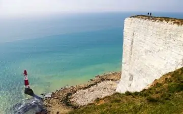 an image of a lighthouse just off the white cliffs of Dover