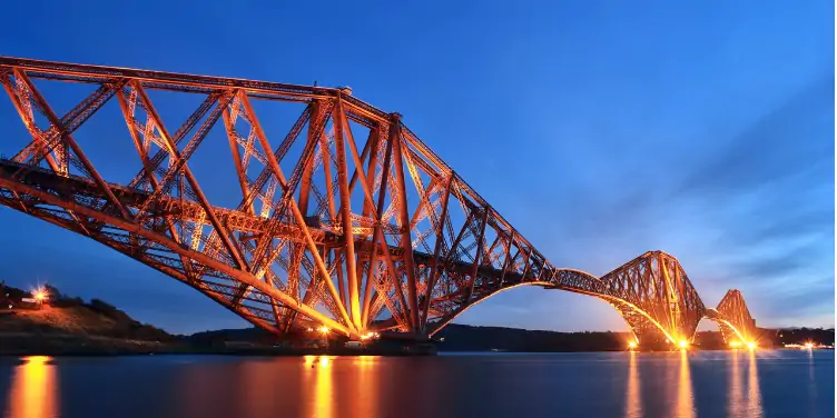 an image of the Forth Bridge, a World Heritage Site in Scotland, at night