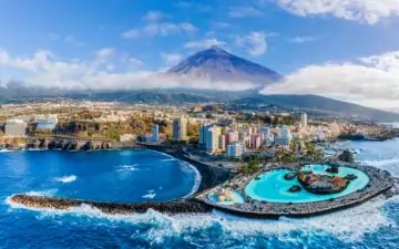 an image of Puerto de la Cruz, Tenerife from above with Mount Teide in the background