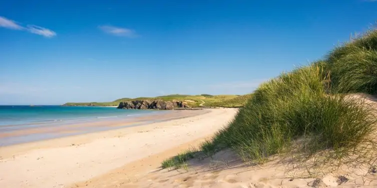 Sand dunes of Balnakeil Beach on a sunny day