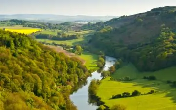 an image of a river running through rural England