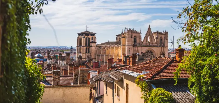 Attractive view of Majestic St Jean Cathedral surrounded by traditional French houses in Lyon