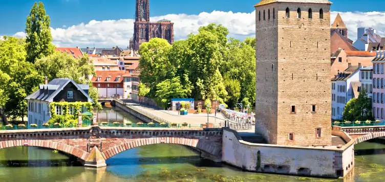 Scenic green river and architectural view of the Strasbourg Barrage Vauban, a great French city break