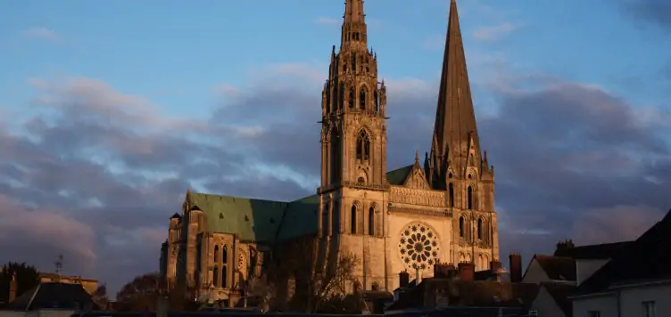 Sunset view of Chartres Cathedral surrounded by french houses